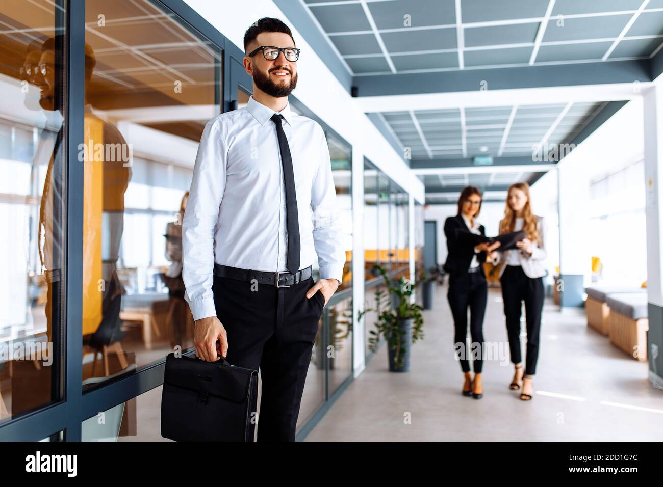 Happy businessman in business clothes in modern office at work Stock ...