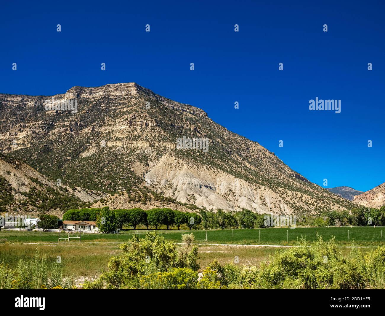 Farmland and the barren mountain, Utah, USA Stock Photo Alamy