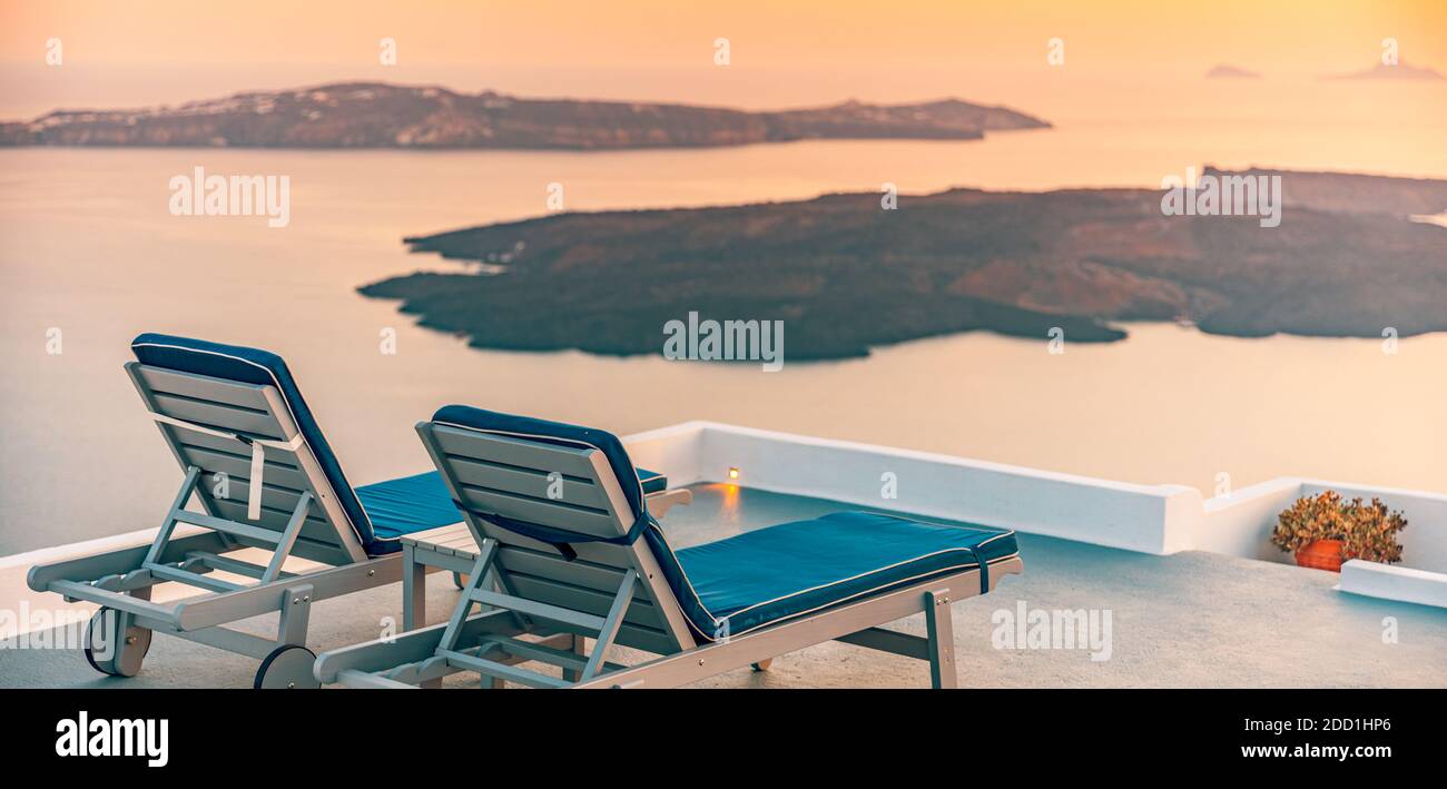 Infinity pool on the rooftop at sunset in Santorini Island, Greece. Beautiful poolside and sunset sky. Luxurious summer vacation and holiday concept, Stock Photo
