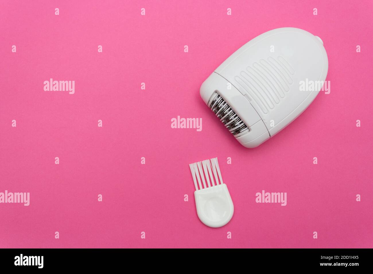 Minimalistic beauty concept. Epilation. White electric epilator hair. Copy space Stock Photo Alamy