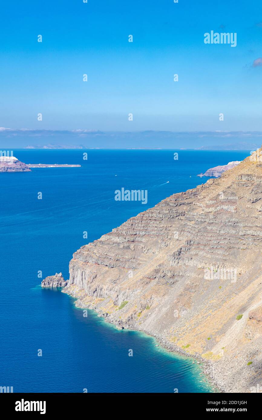 Beautiful natural rock arch near in Santorini island. Amazing blue green sea and sunny day. Stock Photo