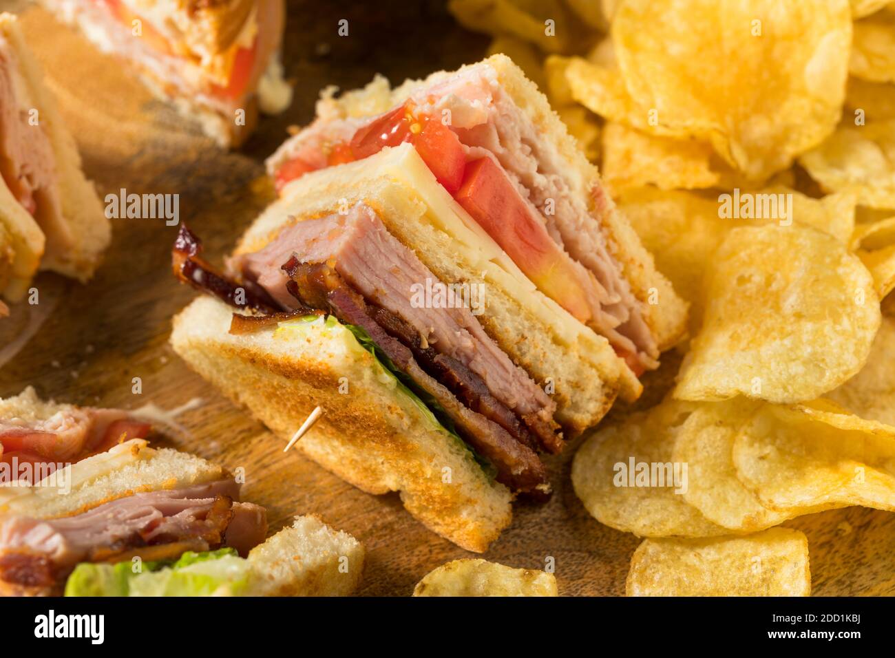 Homemade Turkey Club Sandwich with Bacon Ham and Tomato Stock Photo Alamy