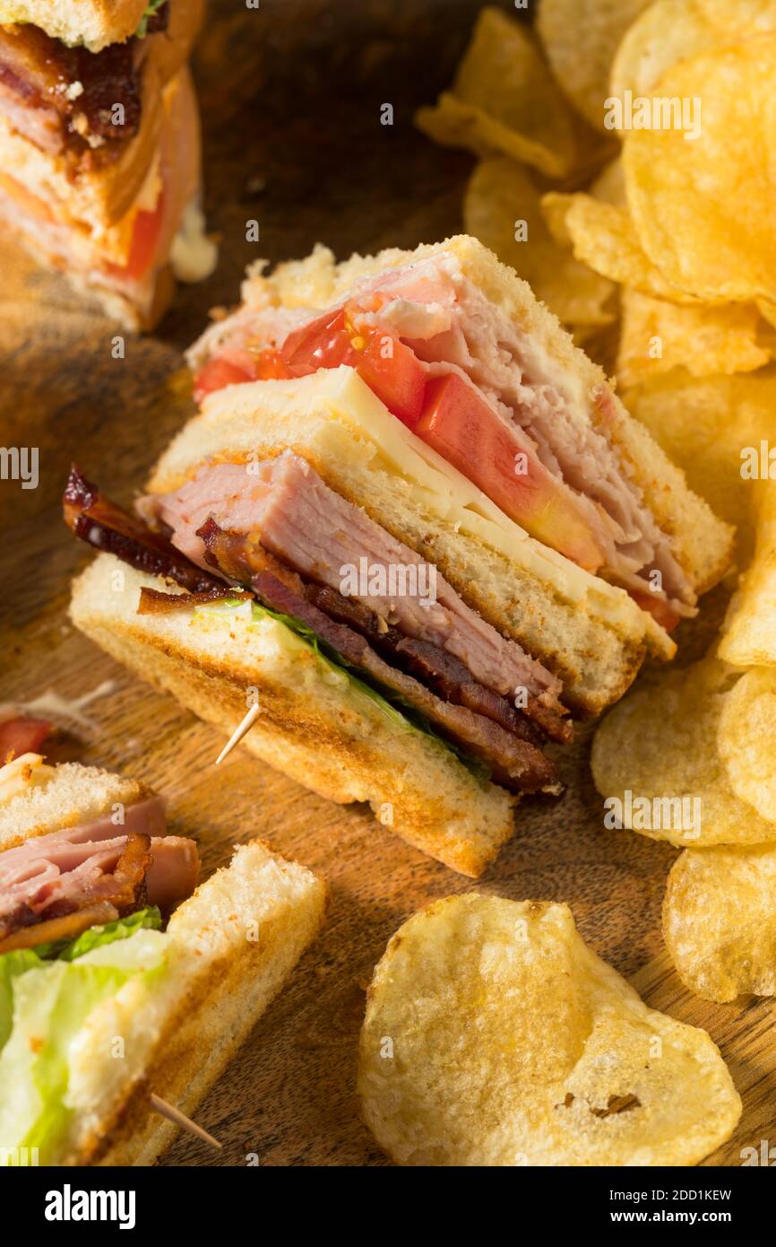Homemade Turkey Club Sandwich with Bacon Ham and Tomato Stock Photo Alamy
