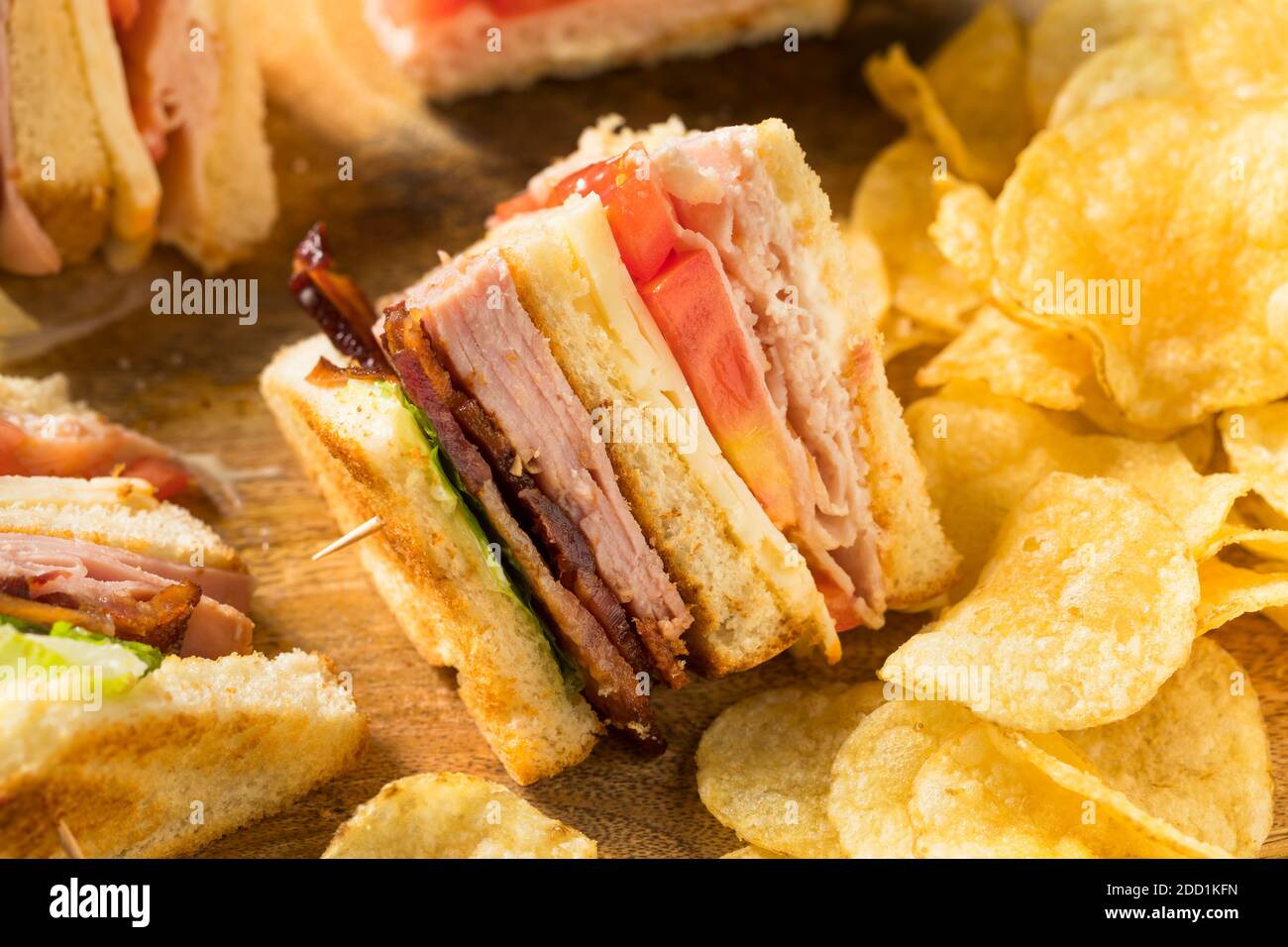 Homemade Turkey Club Sandwich with Bacon Ham and Tomato Stock Photo Alamy
