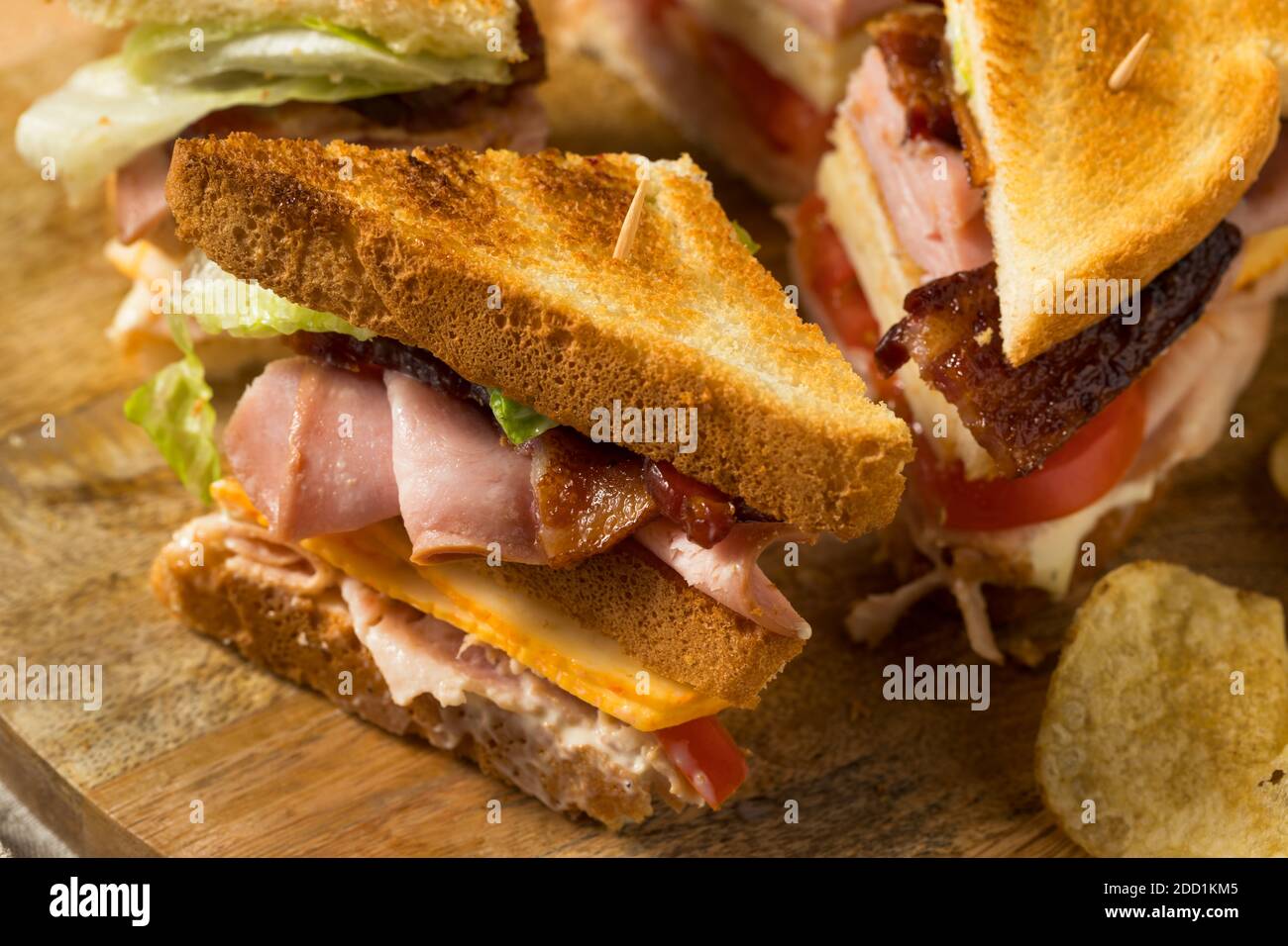 Homemade Turkey Club Sandwich with Bacon Ham and Tomato Stock Photo - Alamy