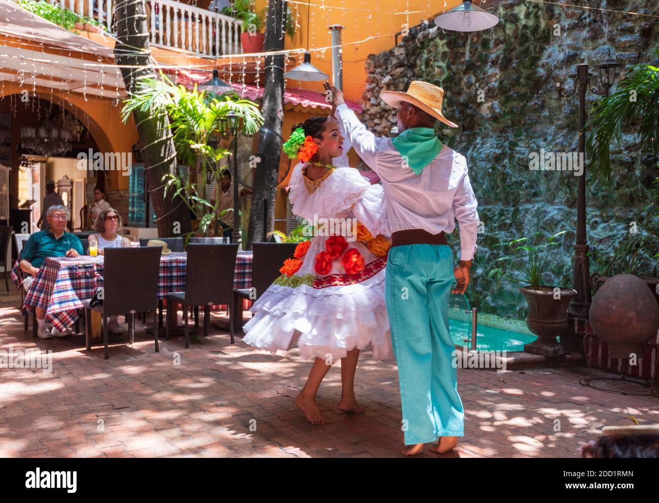 Caretagena, Colombia--April 21, 2018. Dancers in traditional garb perform a dance in a restaurant. Stock Photo