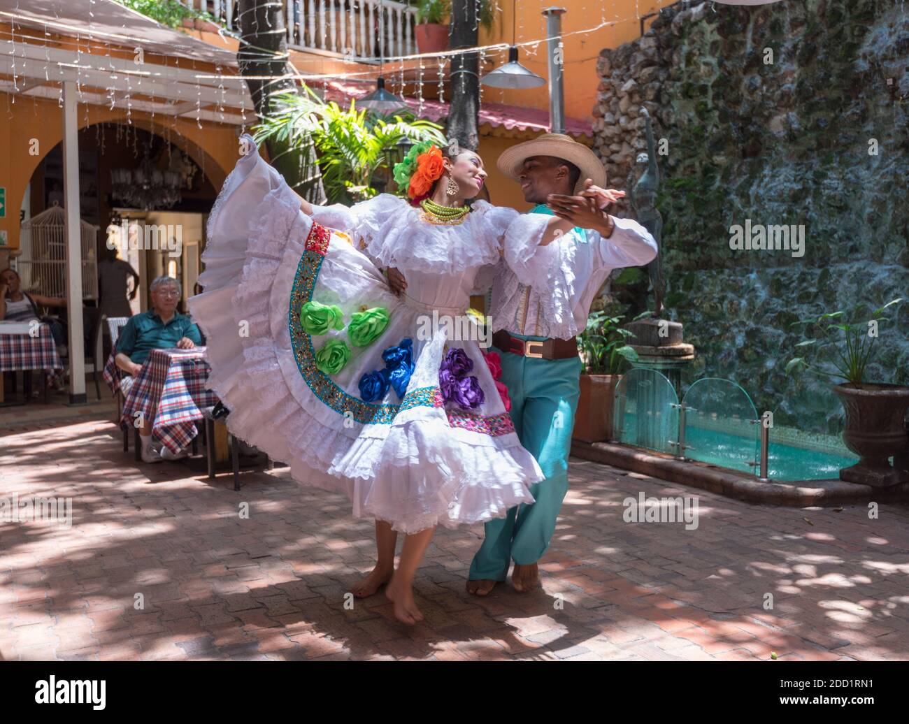 Cartagena, Colombia--April 21, 2018. Dancers in traditional garb perform a traditional dance in a restaurant. Stock Photo