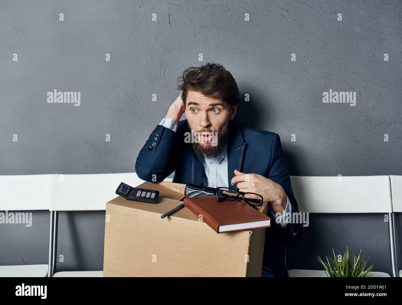 business man box office stuff work sitting on chair Stock Photo - Alamy