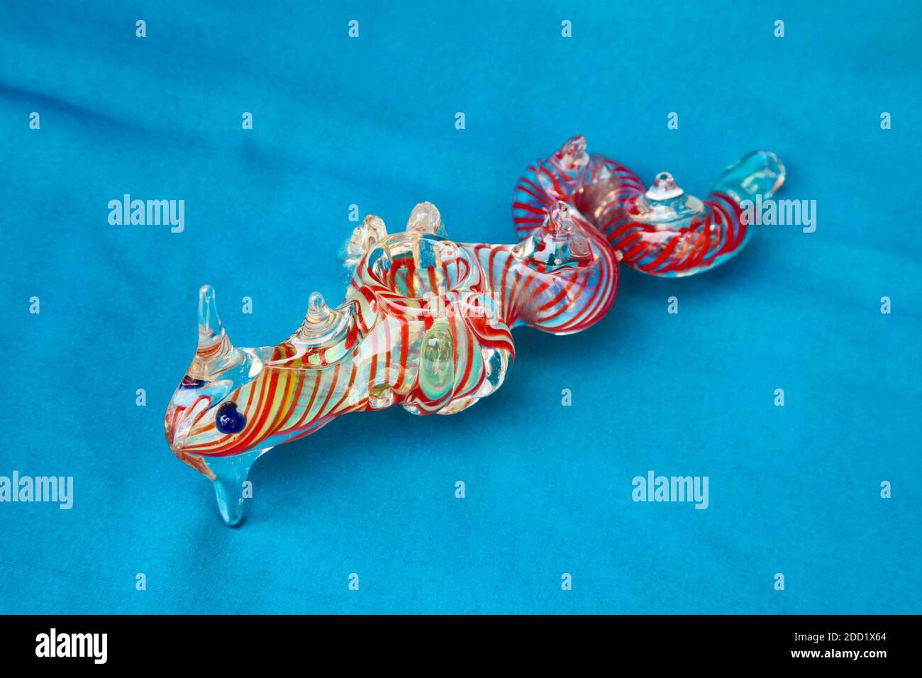 KATHMANDU, NEPAL - MAY 28, 2012: Exclusive design pipe for marijuana smoking on a blue fabric background Stock Photo