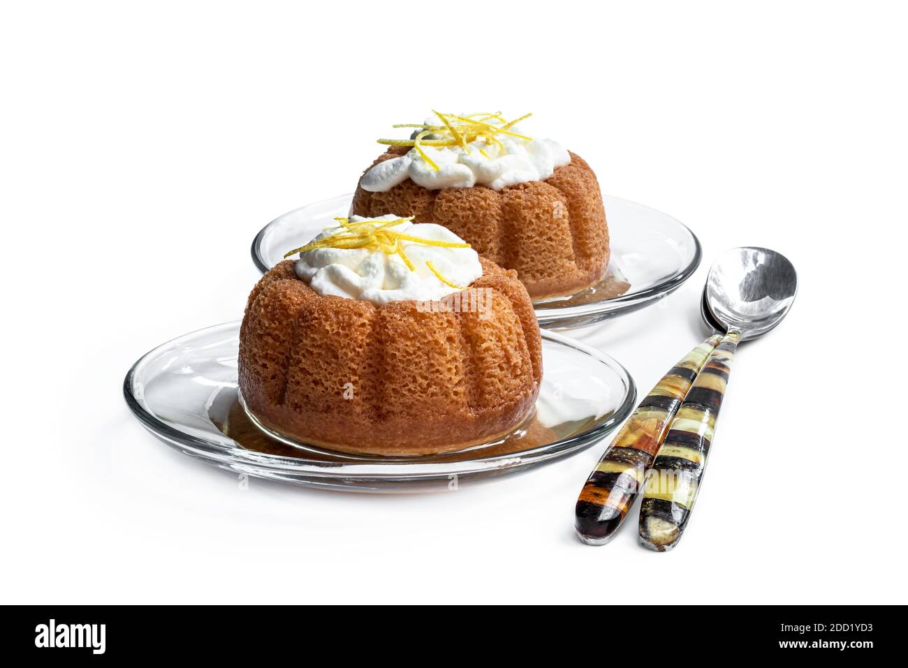 Rum baba decorated with whipped cream isolated on white Stock Photo Alamy