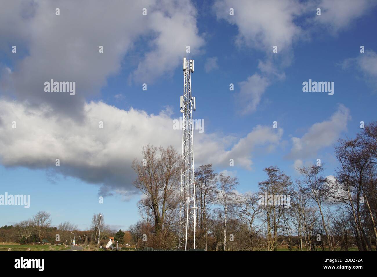 Mast with antennas for mobile in the Dutch village of Bergen in autumn