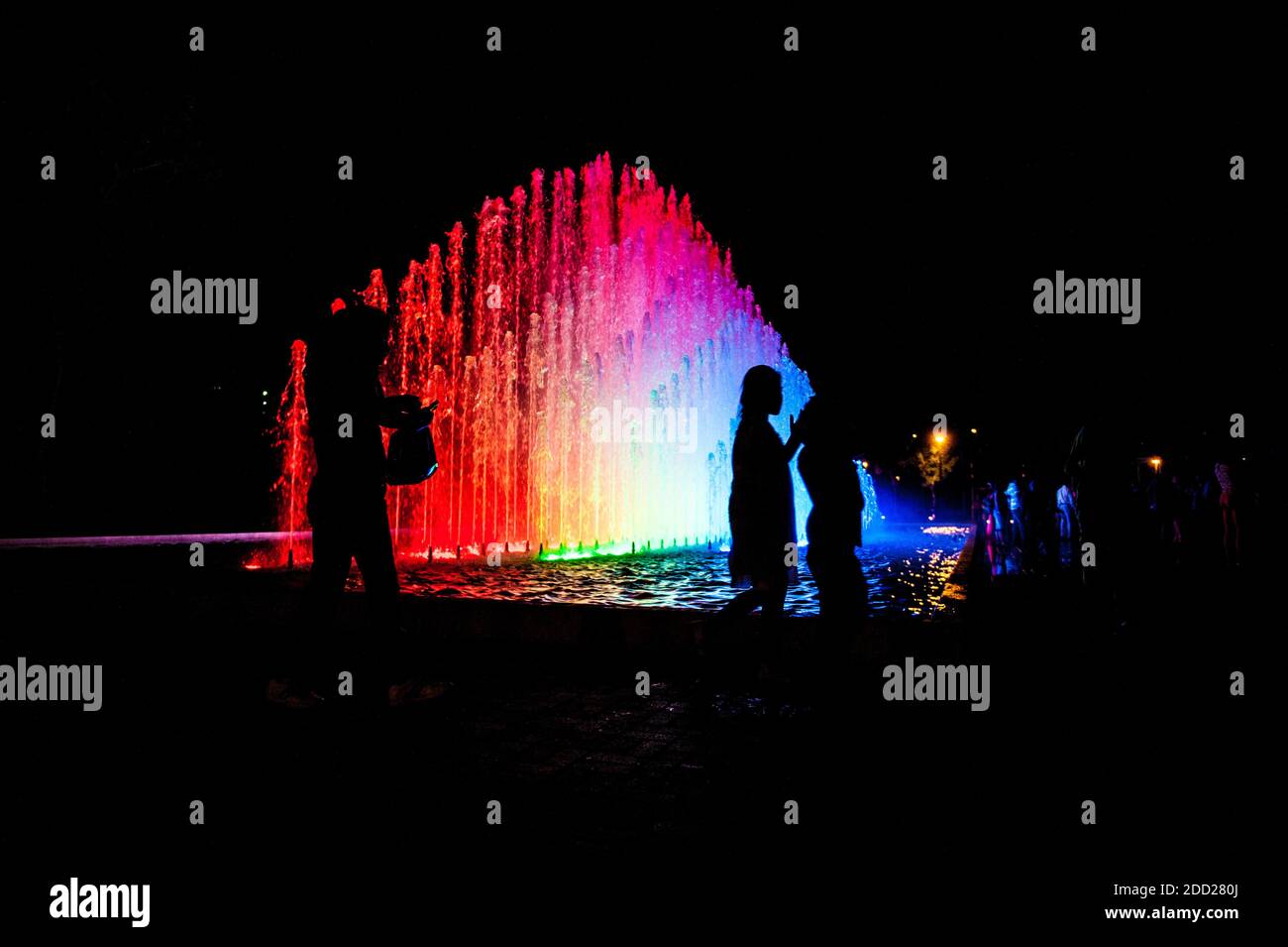 Tourists at Rainbow Fountain at the Magic Water Circuit (world's largest fountain complex), Park of the Reserve, Lima, Peru. Stock Photo