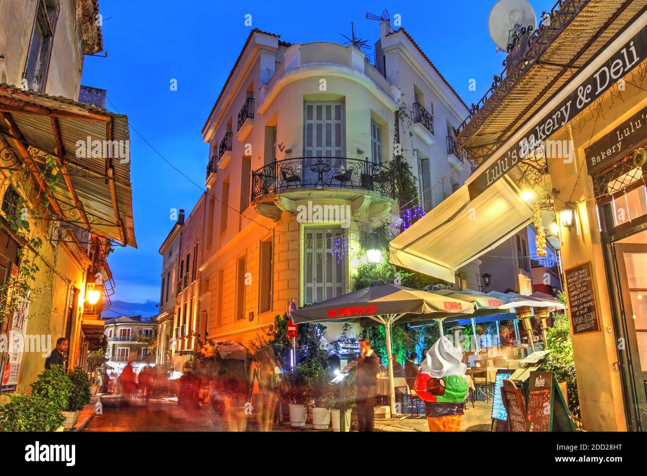 Night street scene in the Plaka district at the foot of the Acropolis in  Greece featuring food and drink establishments Stock Photo - Alamy
