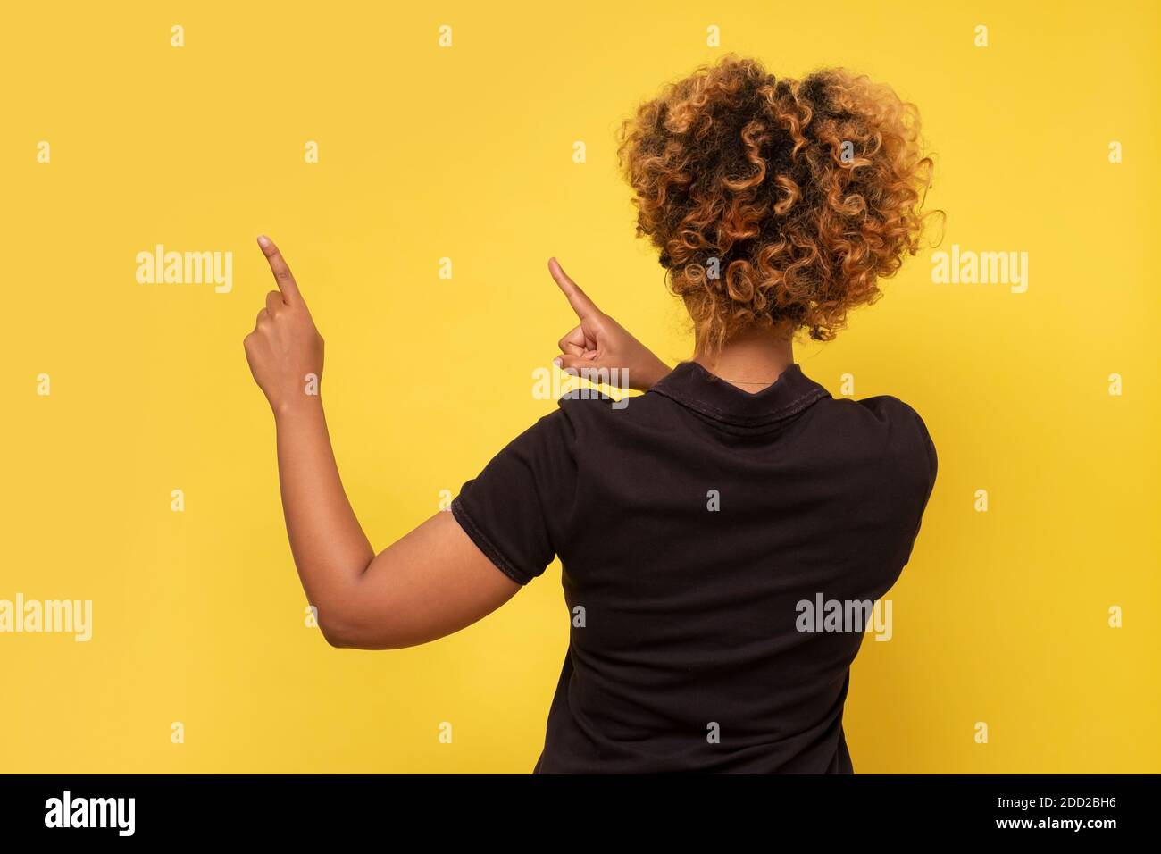 Black woman rear view hand up hi-res stock photography and images - Alamy