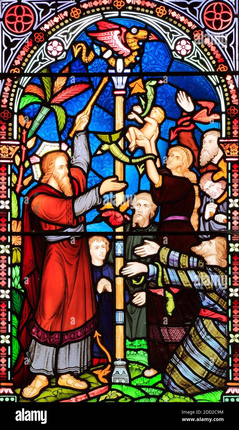 Moses, with bronze snake, on pole, Old Hunstanton,  detail of stained glass, window by Frederick Preedy, 1867, Norfolk, England Stock Photo