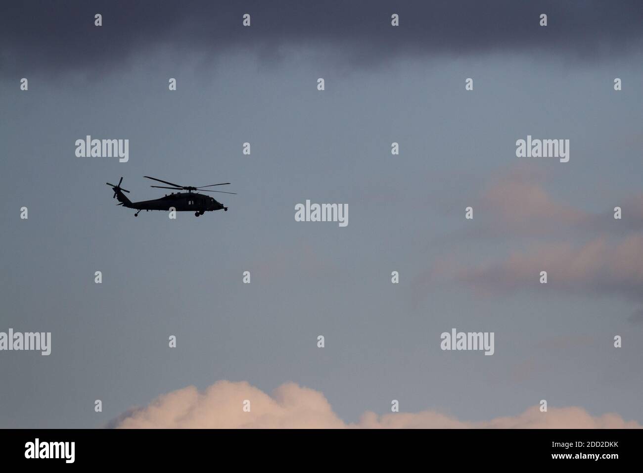 A Sikorsky SH-60 Seahawk helicopter with the US Navy flying near NAF Atsugi airbase. Kanagawa, Japan. Stock Photo