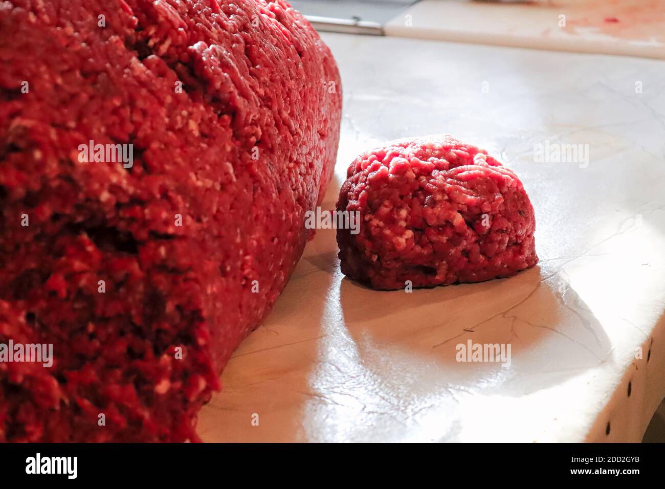 Freshly ground meat coming out of a meat grinder - Stock Image - F017/6580  - Science Photo Library