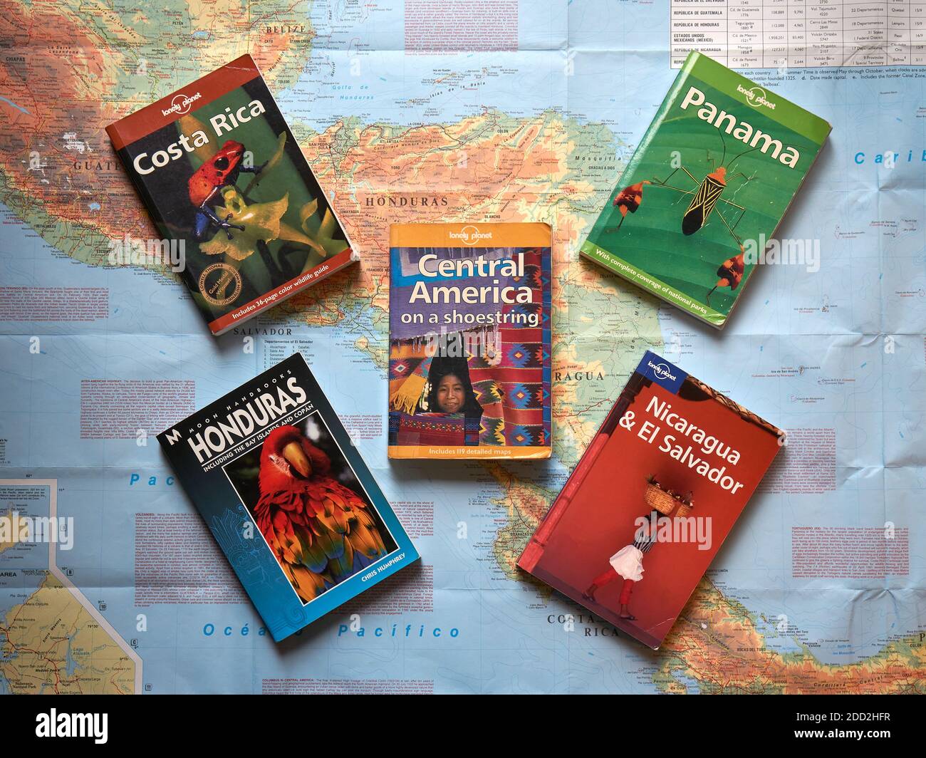 Selection of Central America travel guides and map of Central America from above Stock Photo
