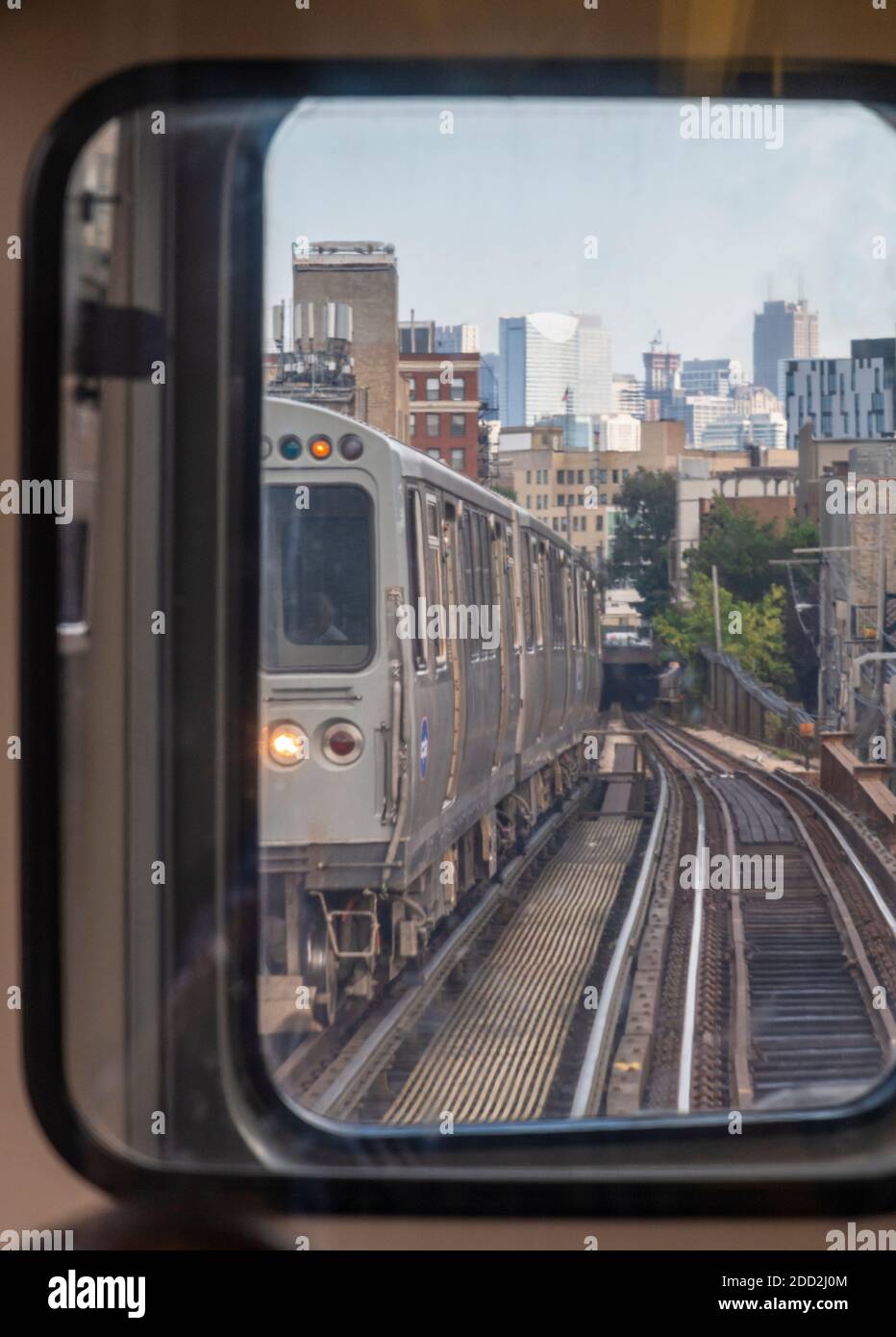 Looking through the window on a train car on the L Train in Chicago Stock Photo