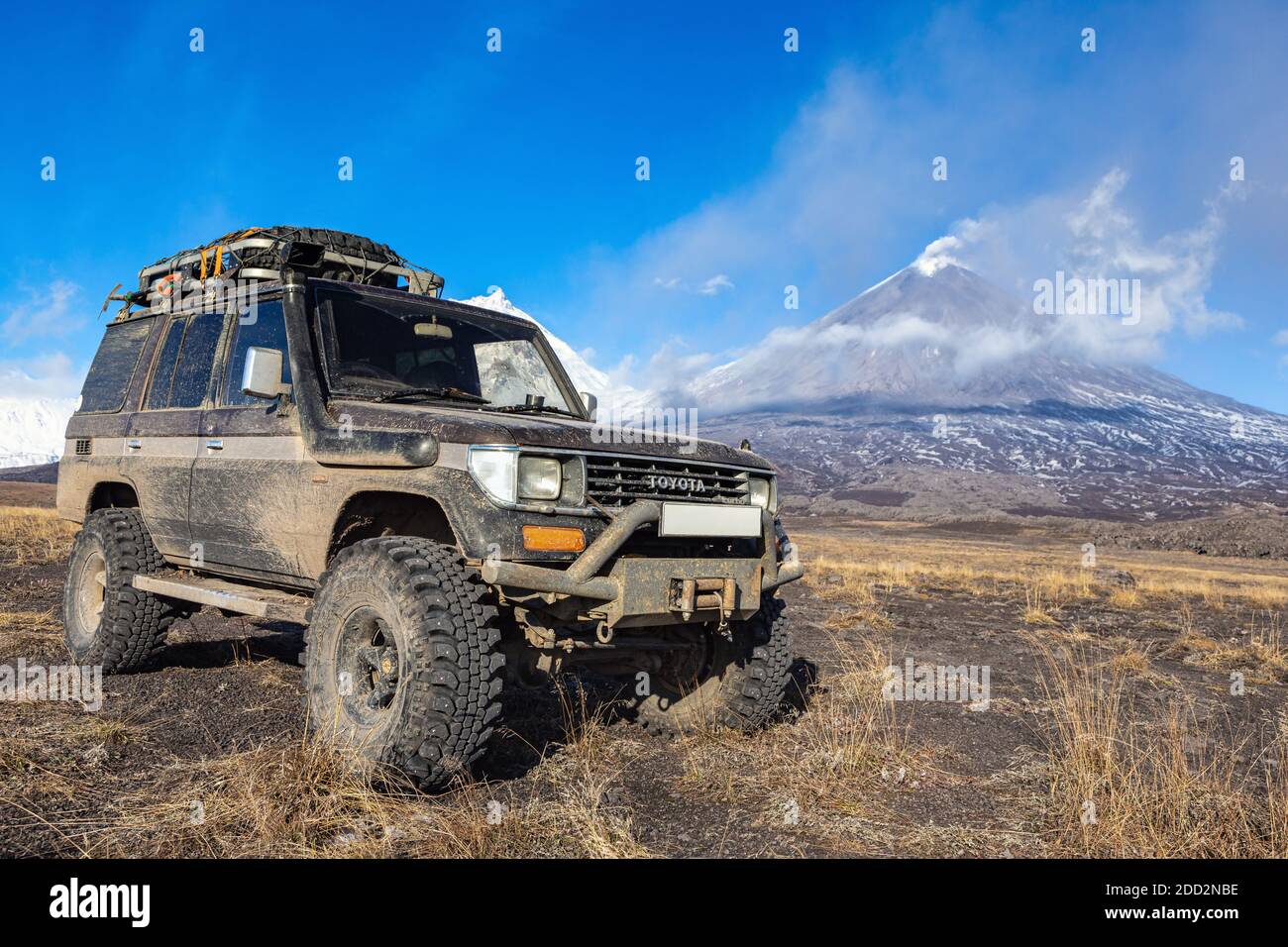 Lifted sport utility vehicle Toyota Land Cruiser Prado on background