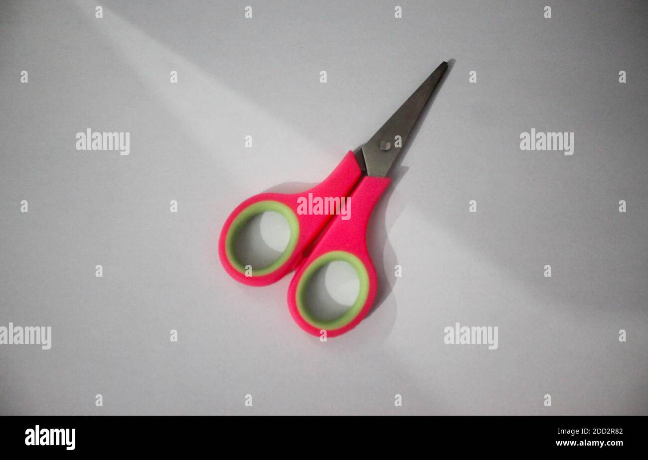 Small scissors pink isolated on white background Stock Photo