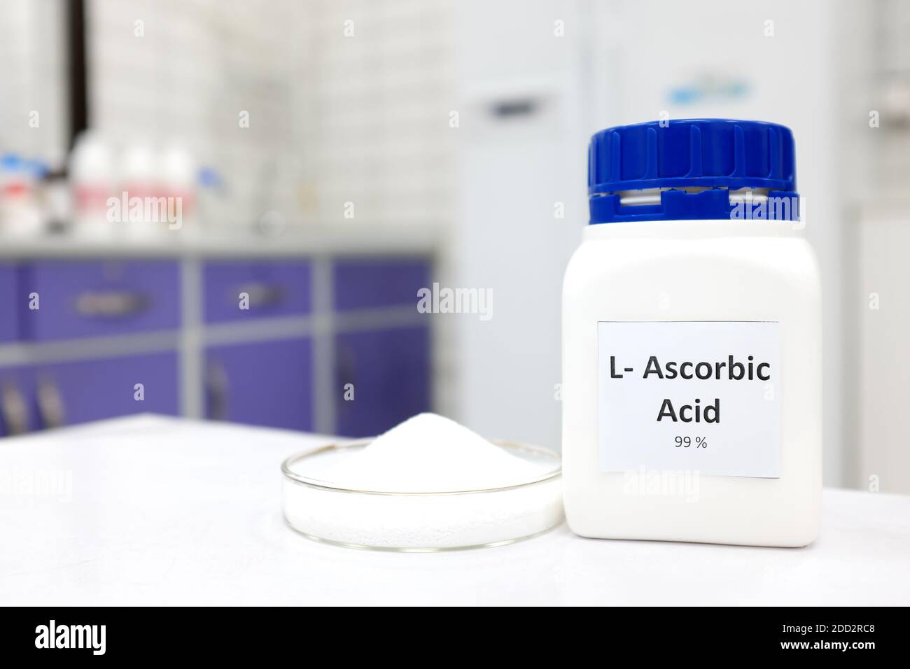 Selective focus of pure vitamin c or ascorbic acid bottle beside a petri dish with white