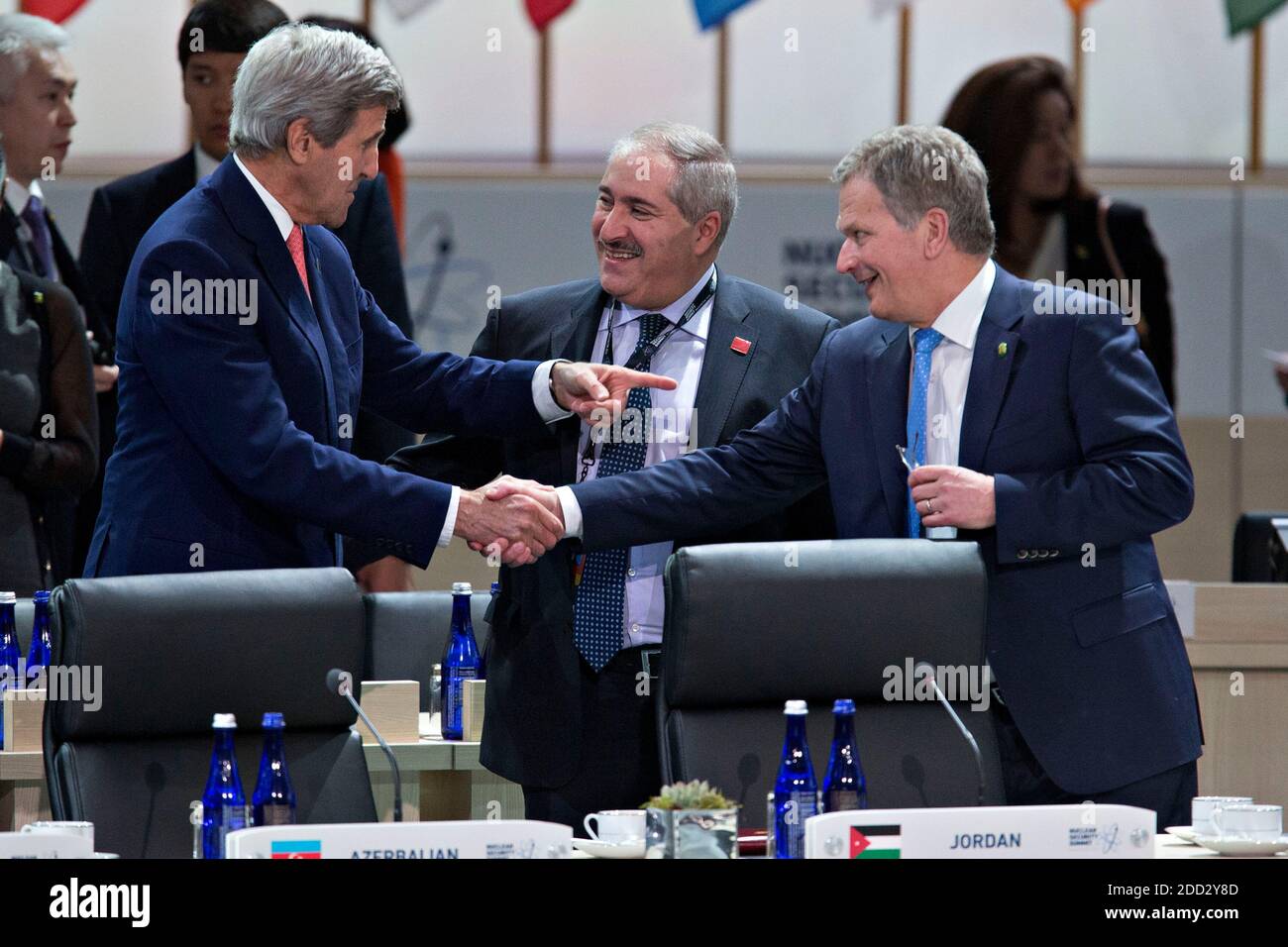 United States Secretary of State John Kerry, left, talks to Sauli Niinisto, Finland's president, right, and Nasser Judeh, Jordan's minister of foreign affairs, center, during a closing session at the Nuclear Security Summit in Washington, DC, U.S., on Friday, April 1, 2016. After a spate of terrorist attacks from Europe to Africa, U.S. President Barack Obama is rallying international support during the summit for an effort to keep Islamic State and similar groups from obtaining nuclear material and other weapons of mass destruction. Credit: Andrew Harrer/Pool via CNP | usage worldwide Stock Photo