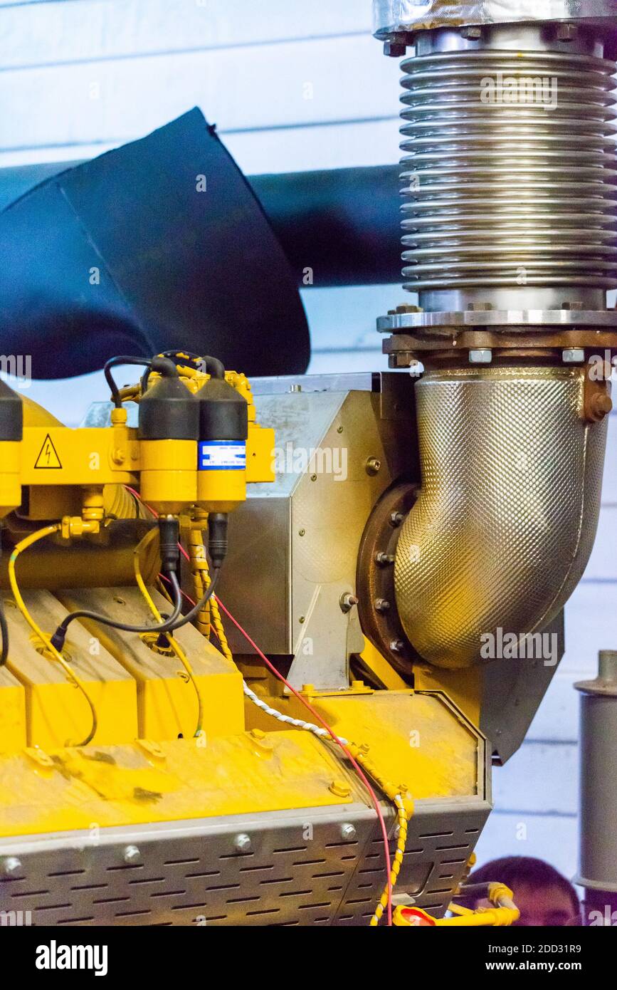 Flexible tubular exhaust pipe. Engine Exhaust Compensator Stock Photo