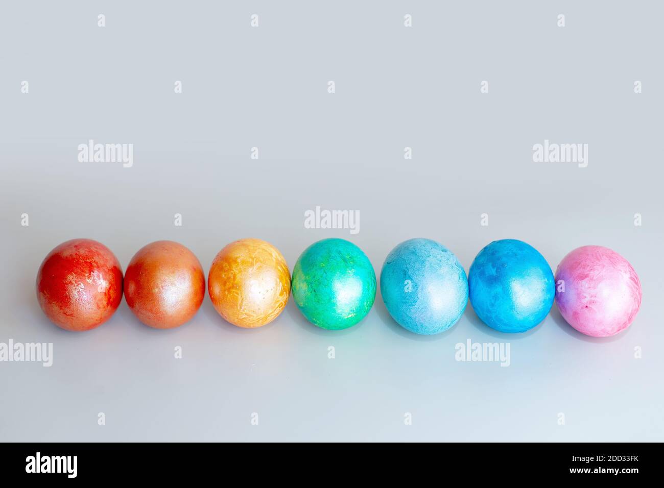 A row of rainbow colored Easter eggs Stock Photo