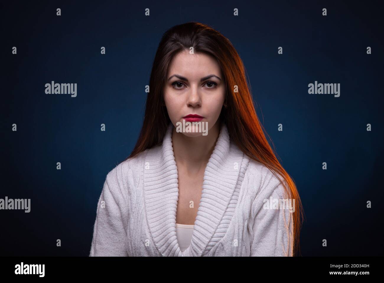 Portrait of brunette young girl with long hair and red lips Stock Photo