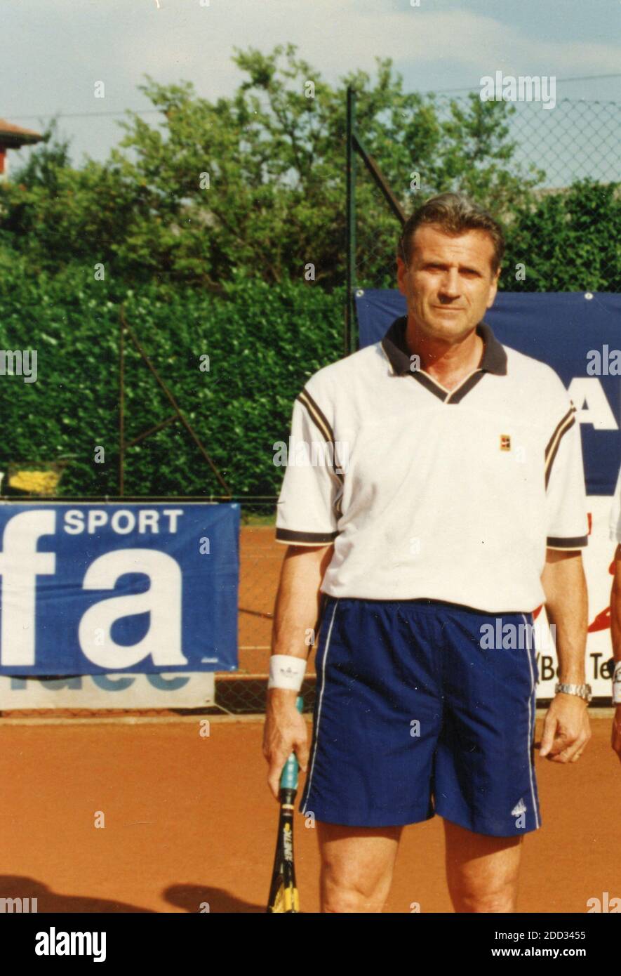Italian football player Giacinto Facchetti playing tennis, 1990s Stock Photo