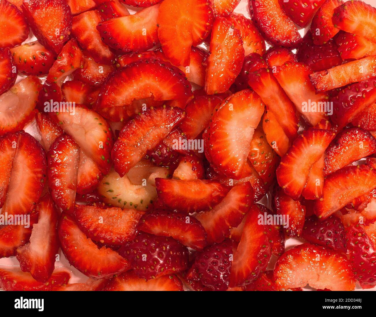 closeup of the cut strawberries Stock Photo - Alamy