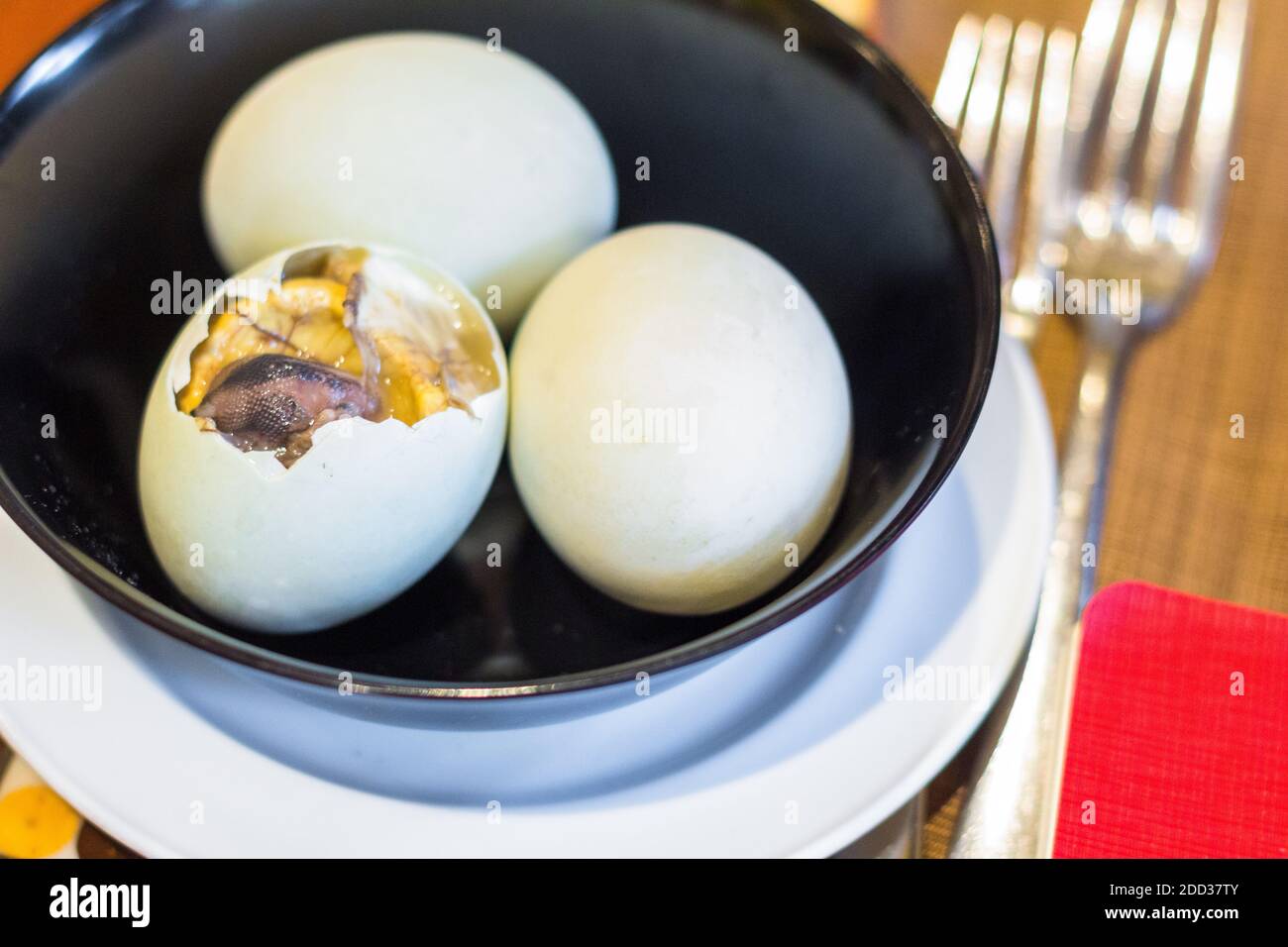 Duck egg embryo or balut, a popular Filipino food from the Philippines served at the Marco Polo Hotel Stock Photo