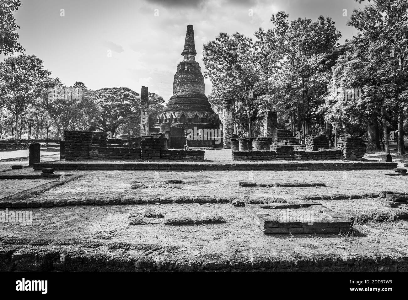Landmark of old chedi made of ancient bricks in the Kamphaeng Phet Historical Park, Thailand. Black and white Stock Photo