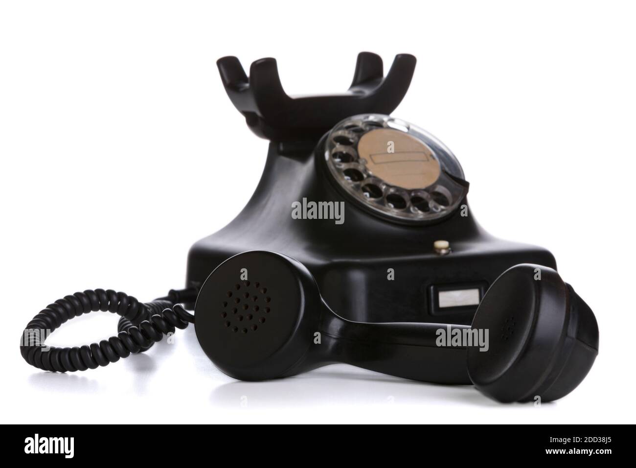 Vintage telephone with receiver taken off in focus, isolated on white background Stock Photo