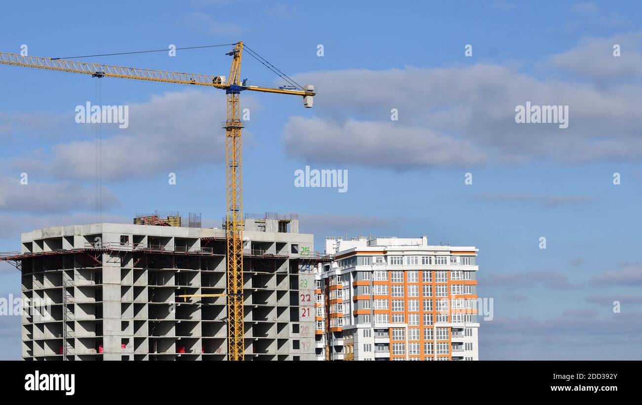 Construction site at rooftop of unfinished skyscraper with big tower ...