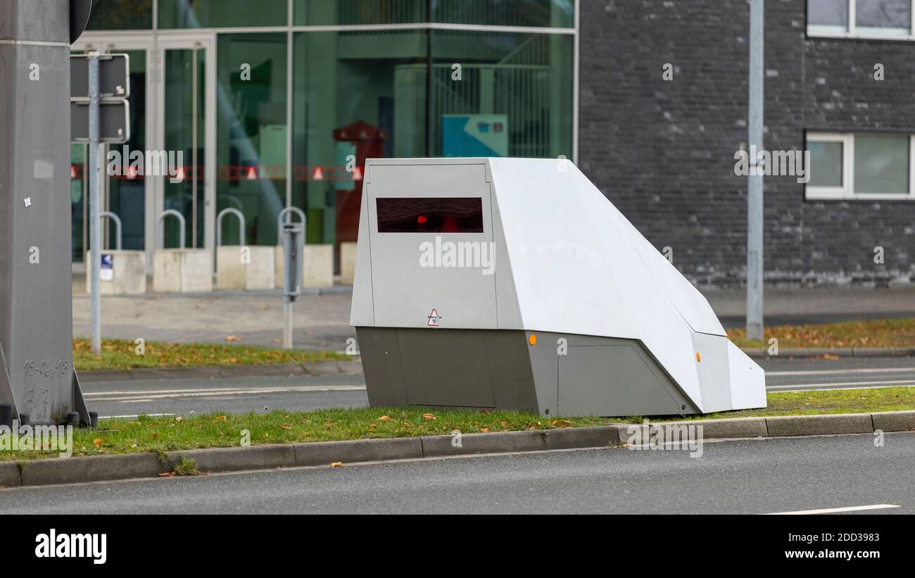 German police are using mobile speed cameras to monitor driving speed inside city limits. Driving too fast results in a flash and a speeding ticket. Stock Photo
