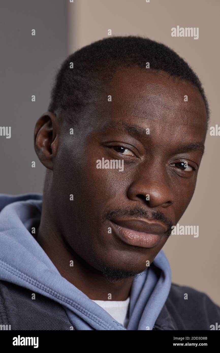 Close-up of African man looking at camera Stock Photo - Alamy