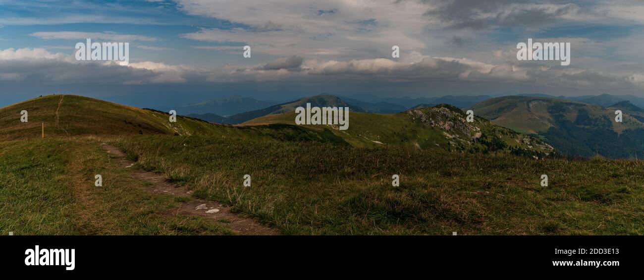 View from Ostredok hill summit in Velka Fatra mountains in Slovakia during late summer day with blue sky and clouds Stock Photo