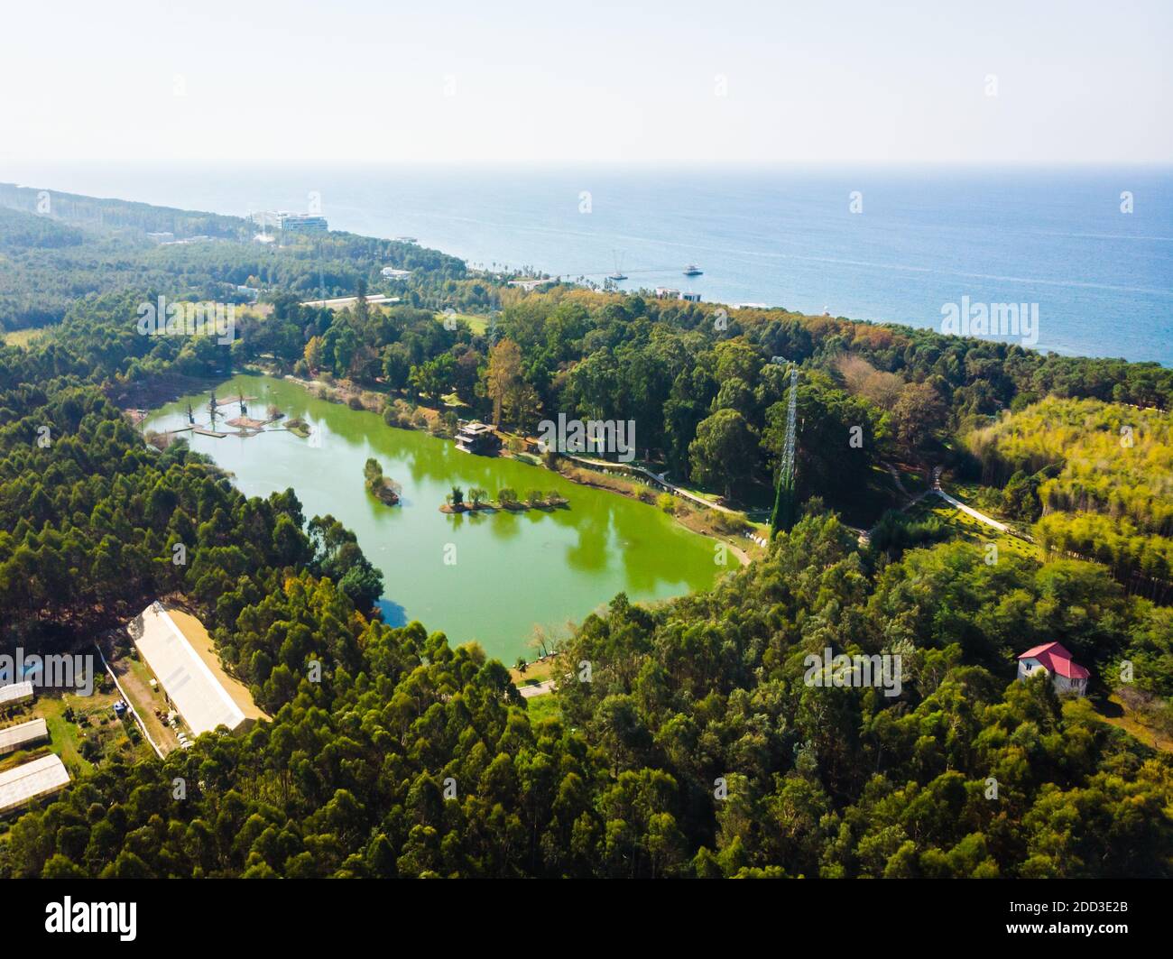 Dendrological aerial view with green lake and blue black sea in the background.2020 Stock Photo