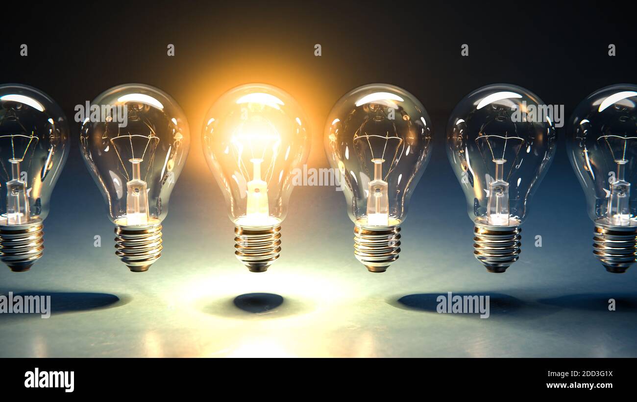 A row of lightbulbs with one brigthly lit - concept for having an idea, innovation, standing out. Stock Photo
