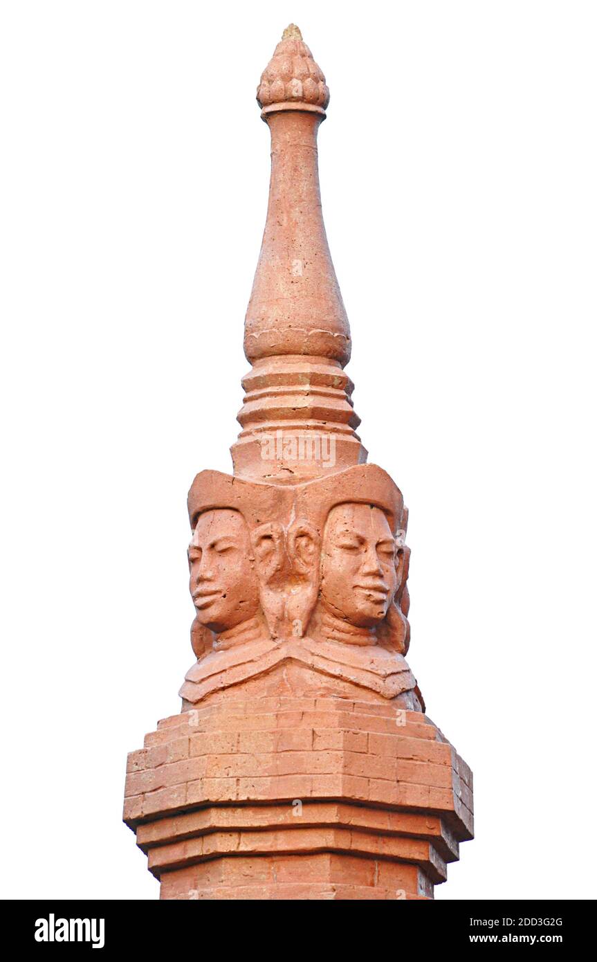 Top of ancient Thai pagoda with human face sculpture Stock Photo