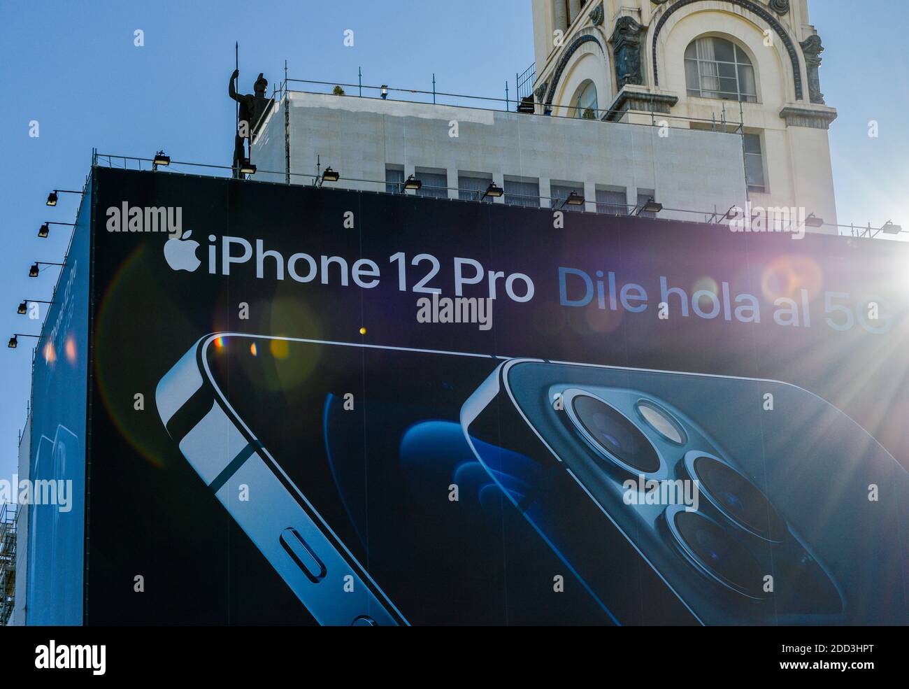 Huge billboard advertising panel for iPhone 12 covering a building in central Madrid Stock Photo