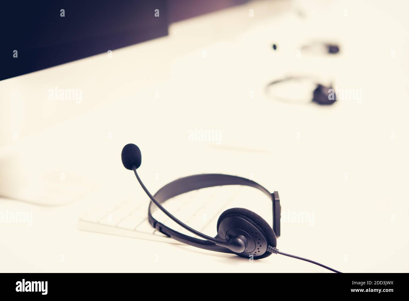 Microphone headsets on the table with computer keyboard call center