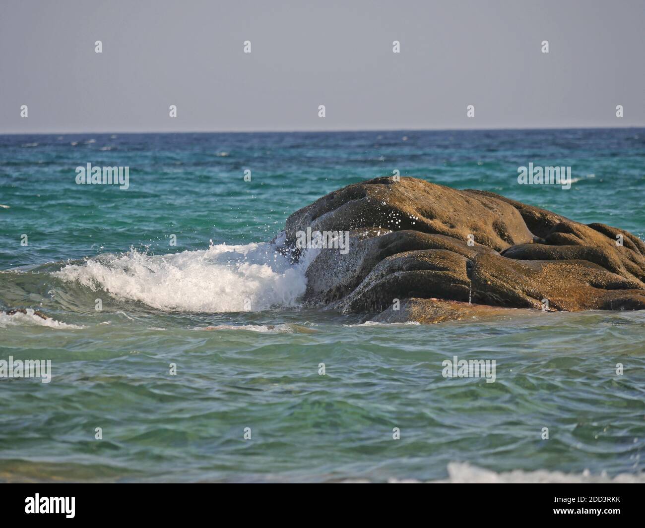 Waves crashing against the rock, natural background Stock Photo - Alamy
