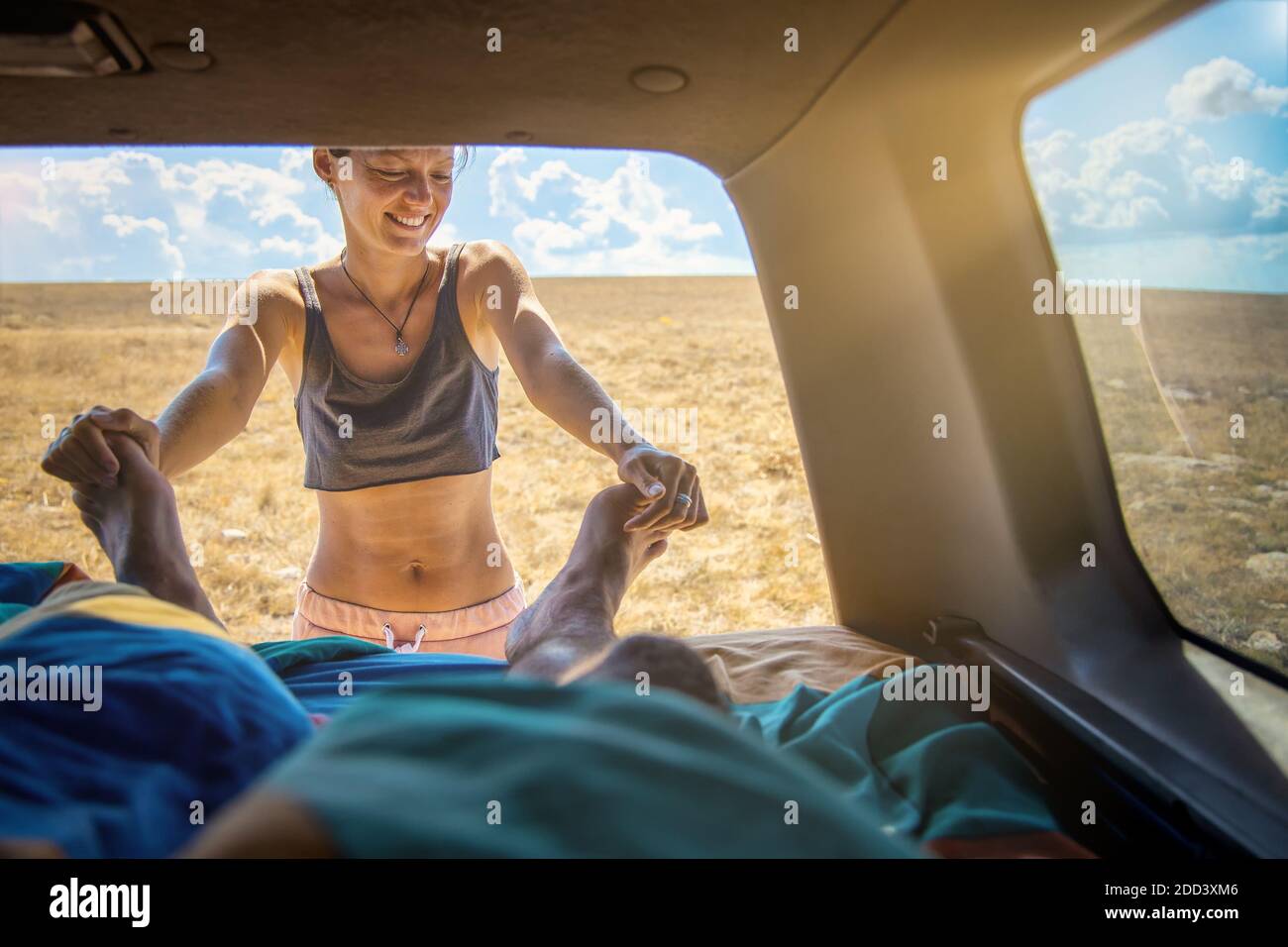 Morning of young couple on a road trip. Two people in camper van Stock Photo