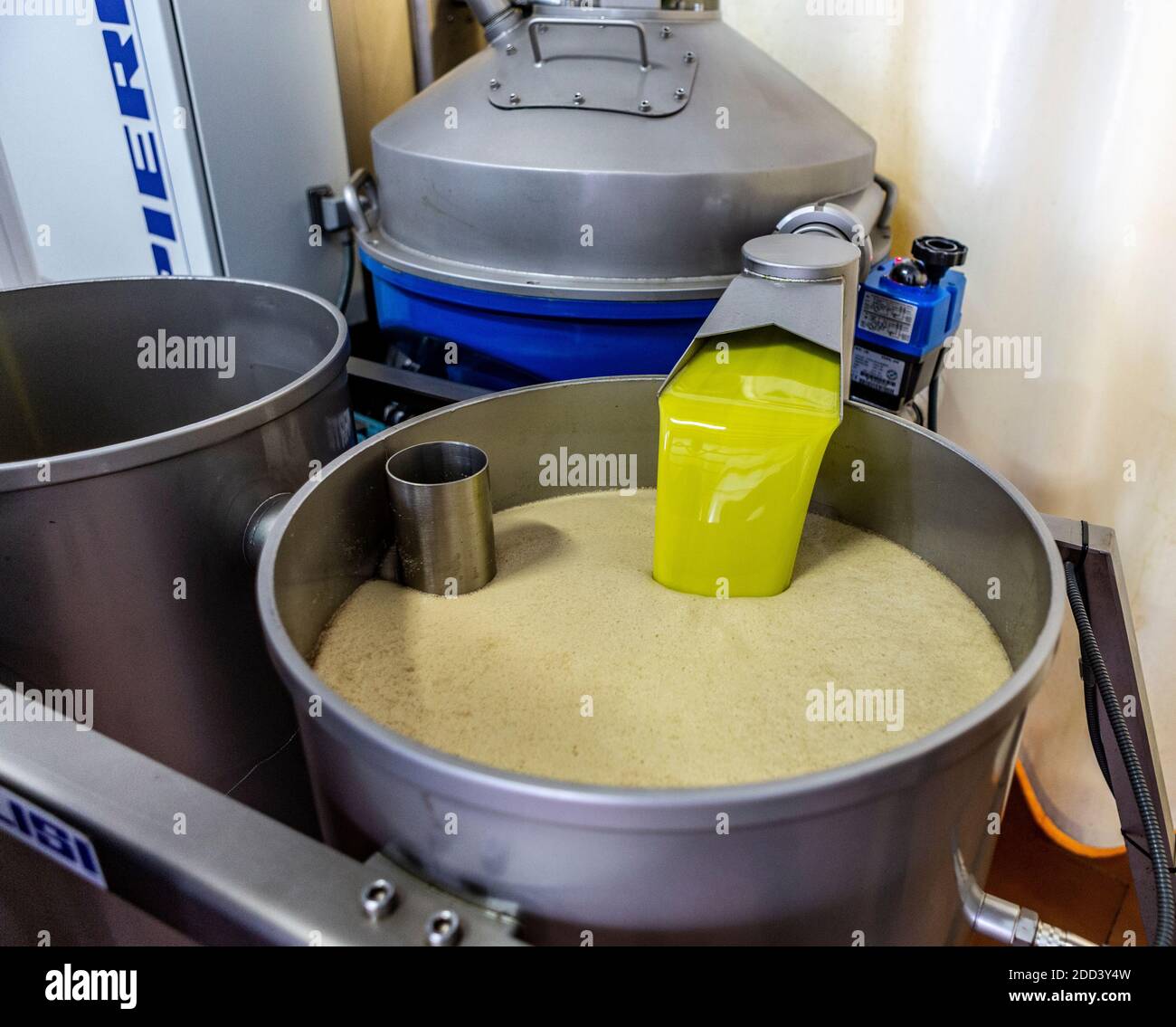 Olive oil being processed in Begijar in Andalusia in southern Spain. The factory belongs to the San Francisco Olive Oil Company. Stock Photo