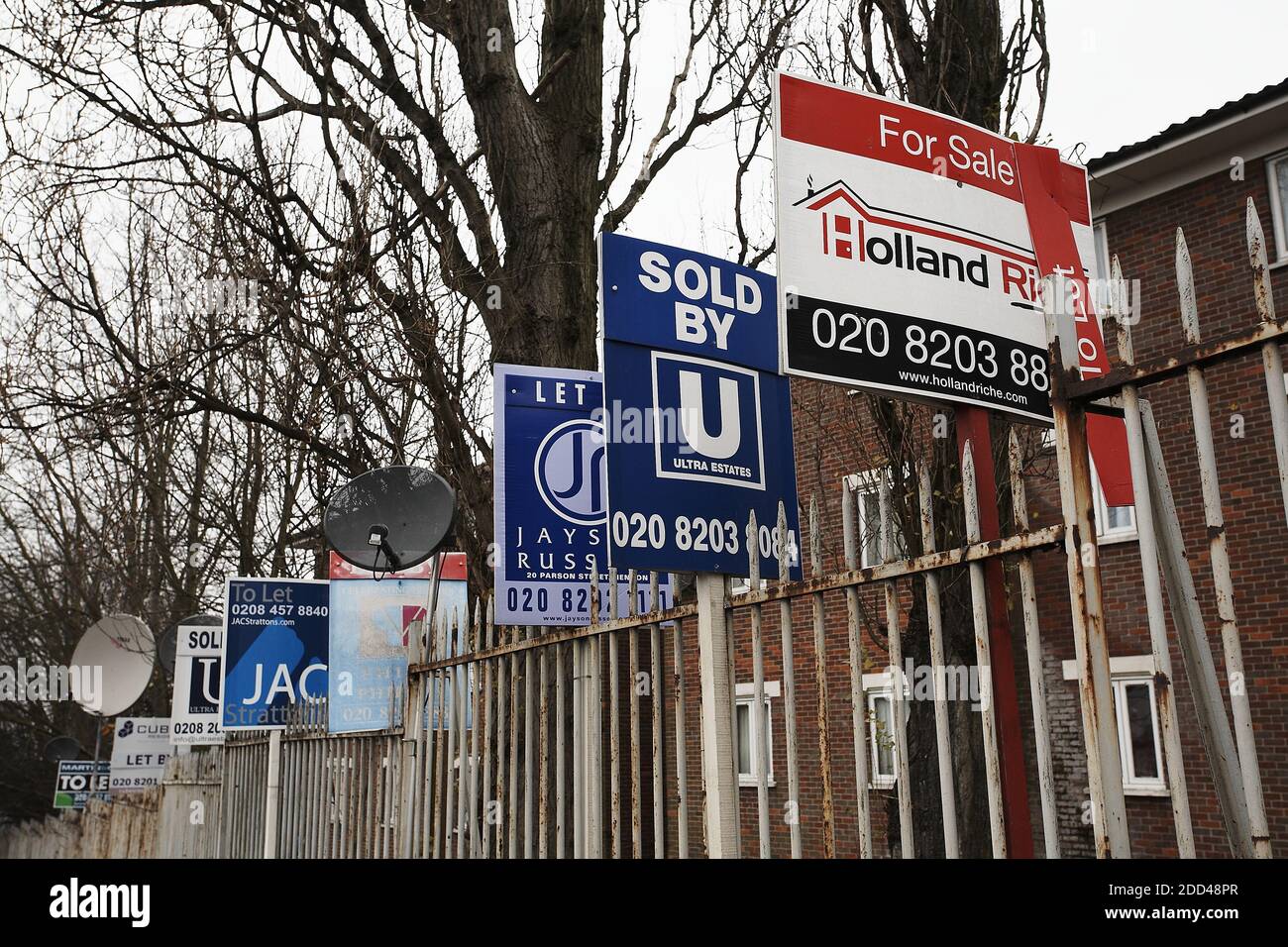 GREAT BRITAIN / England / London/  A collection of estate agents boards advertising properties for sale and to let. Stock Photo