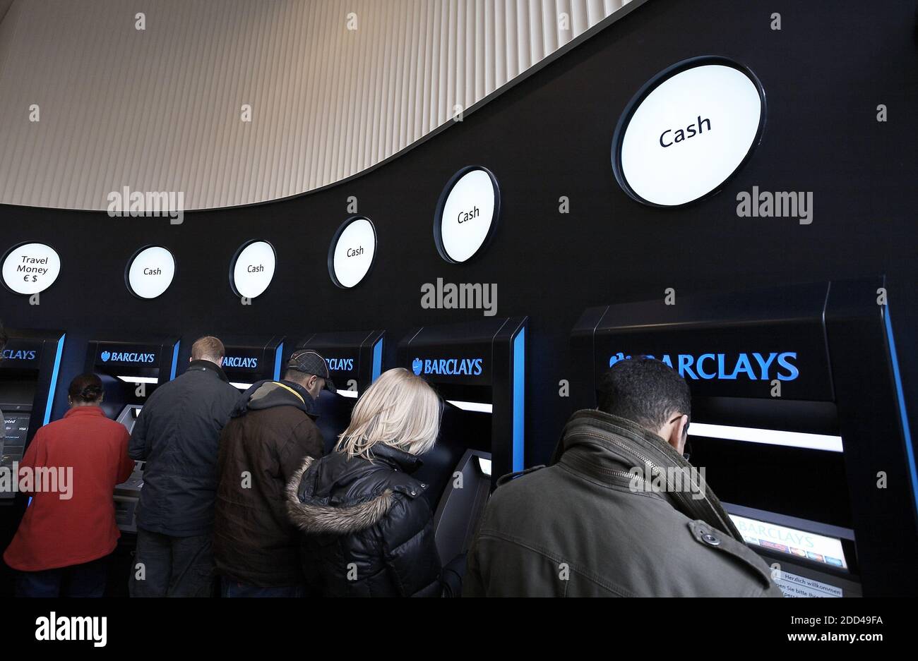 GREAT BRITAIN / London /Customers use a cashpoint machine at a Barclays Bank branch in London . People withdrawaL cash at ATM . Stock Photo