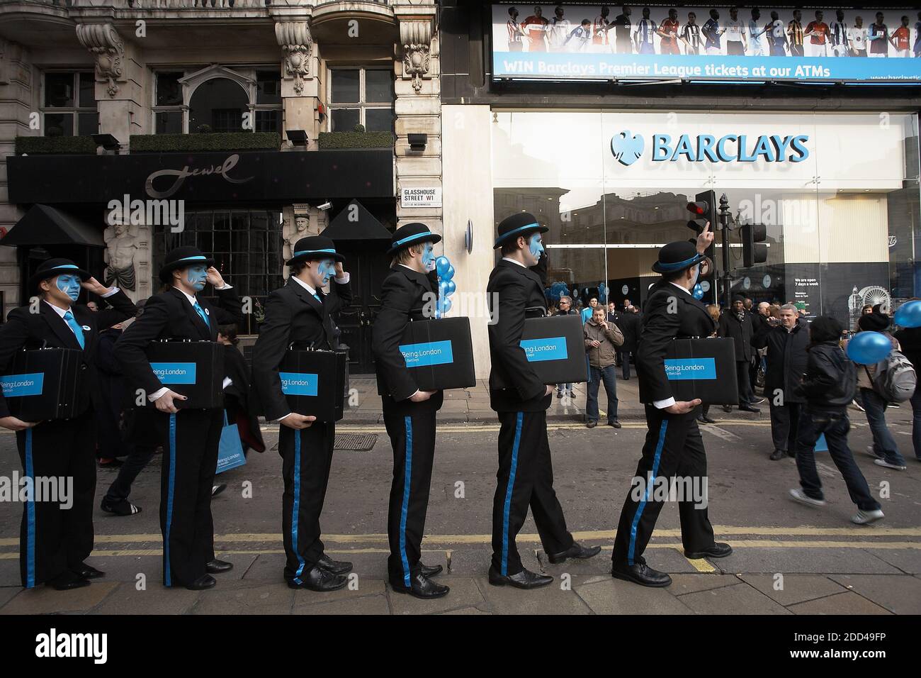 GREAT BRITAIN / England / London /Street performers with painted faces cellebrating the opening  of Barclays Bank  branch at Piccadilly Circus. Stock Photo